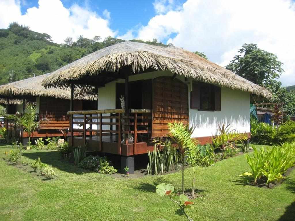 Traditional Polynesian bungalow at Fare Arearea in a tropical garden